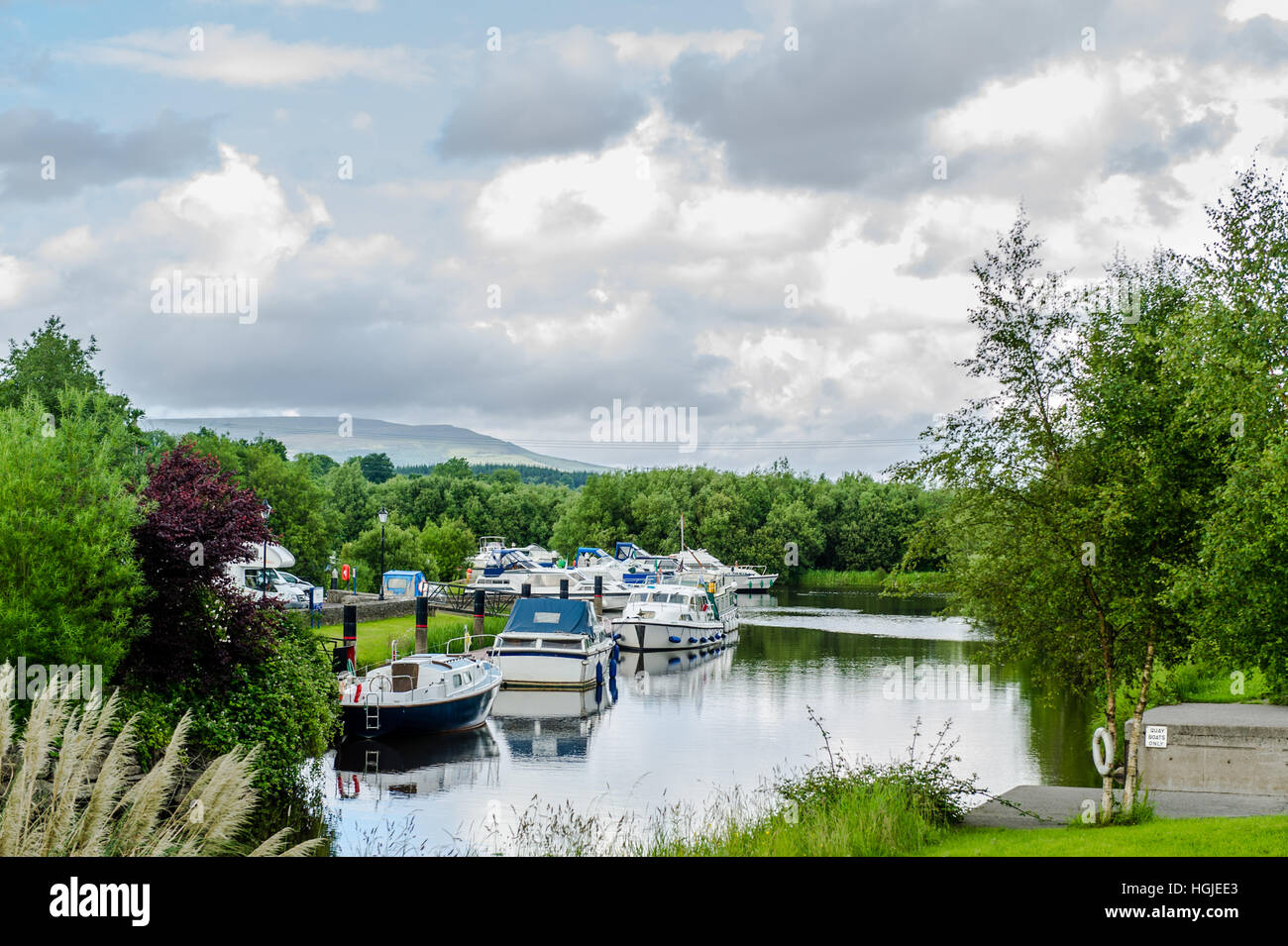 Boats moored on a canal in County Leitrim, Ireland. Stock Photo