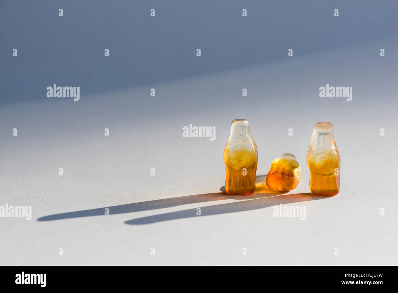 Group of three soft candy / jelly beans in the shape of bottles. Looks