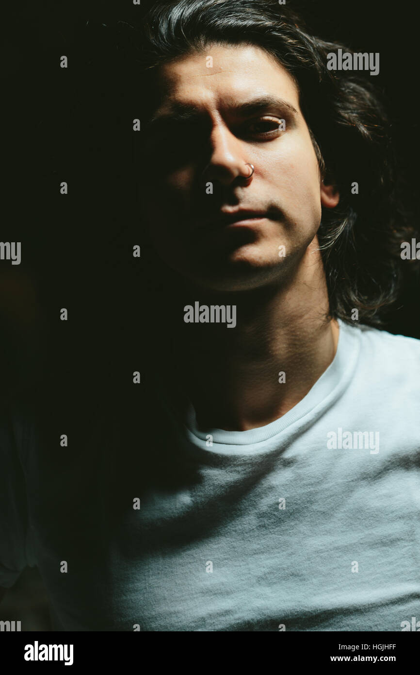 Handsome young man long hair hi-res stock photography and images - Alamy