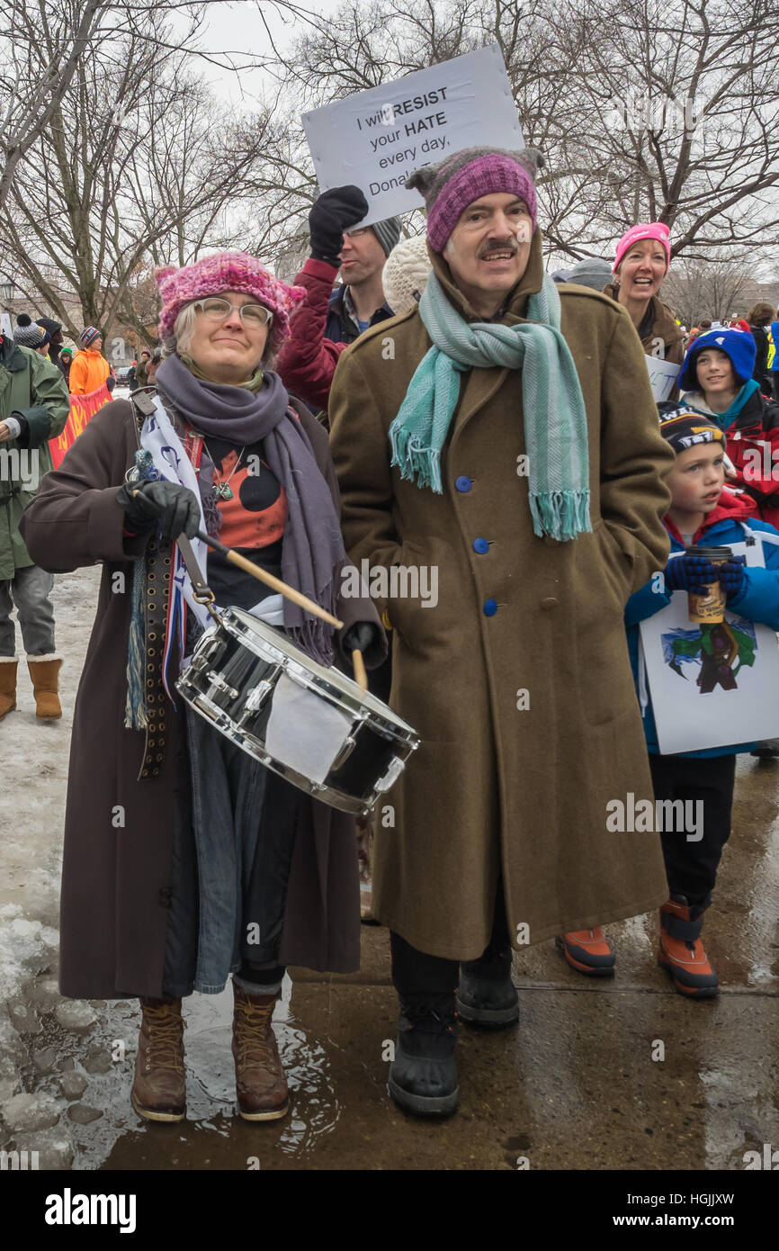 Saint Paul, Minnesota, USA. 21st January, 2017.  A woman with a drum walks in the Women's March in St. Paul, Minnesota. Cindy Carlsson/Alamy Live News Stock Photo