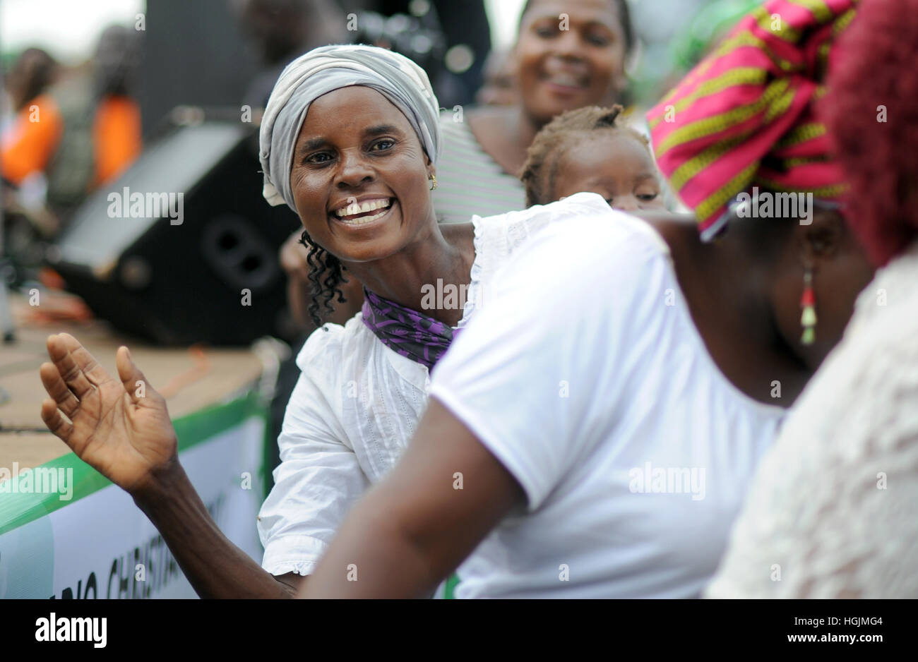 Lusaka, Zambia. 08th Mar, 2016. A women with an infant on her back dances at a celebration of International Women's Day in Lusaka, Zambia, 08 March 2016. Photo: Britta Pedersen/dpa-Zentralbild/ZB/dpa/Alamy Live News Stock Photo