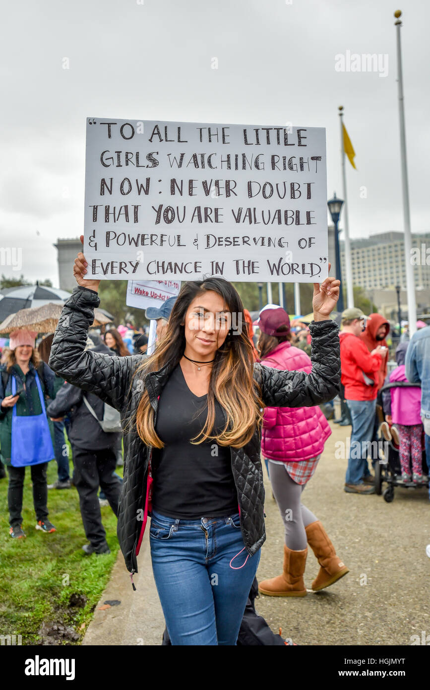 San Francisco, California, USA. 21st January, 2017. A woman holds a sign 'To all the little girls watching...' in San Francisco's Civic Center Plaza during the rally before the San Francisco Women's March. Credit: Shelly Rivoli/Alamy Live News Stock Photo