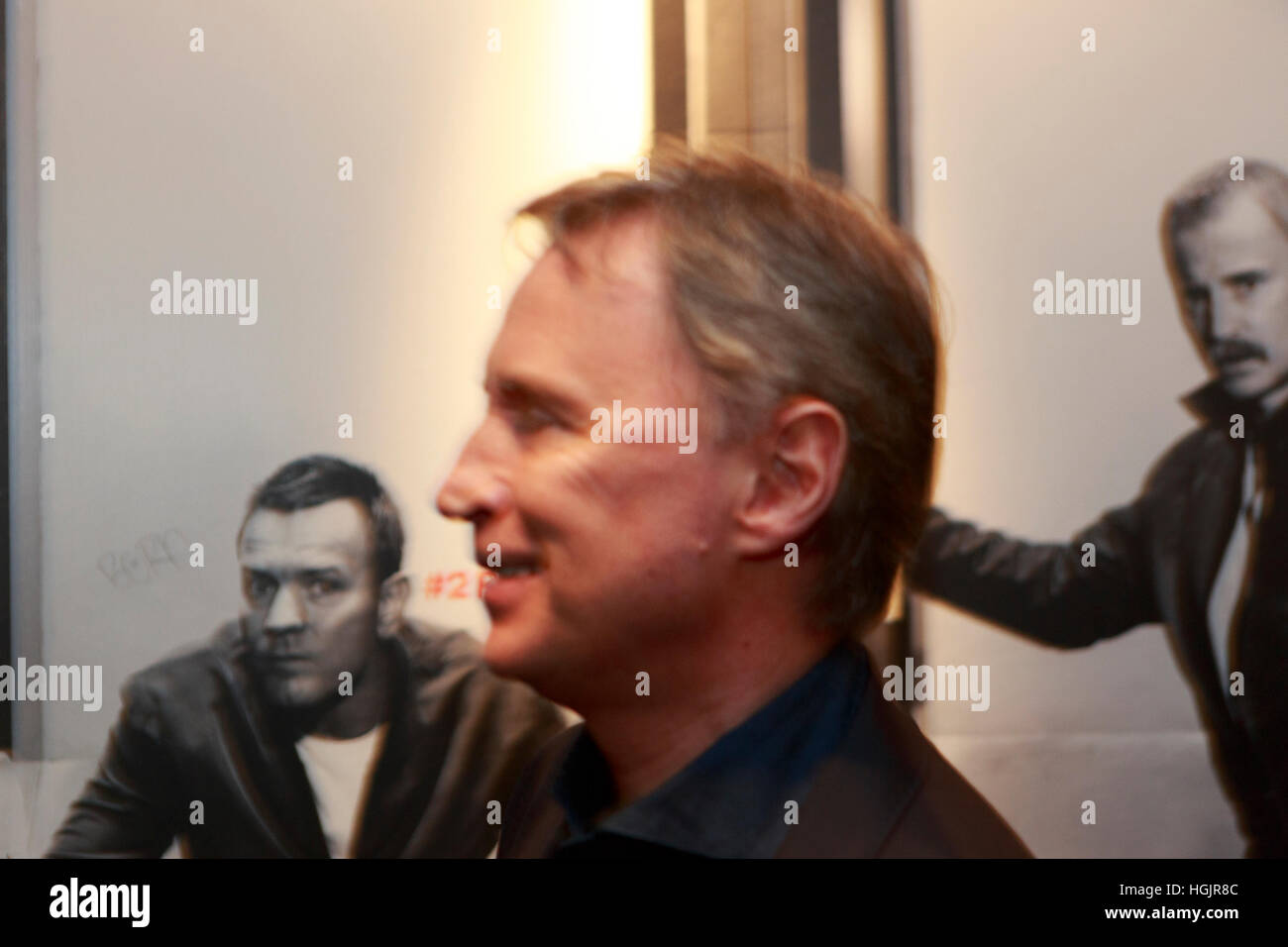 Edinburgh, UK. 22nd January, 2017. T2 Trainspotting premiere at Edinburgh Cineworld. Artist picture where the background is formed for two member of the T2 Transpotting (Ewan McGregor and Robert Carlyle) looking to Robert Carlyle who is walking. Stock Photo
