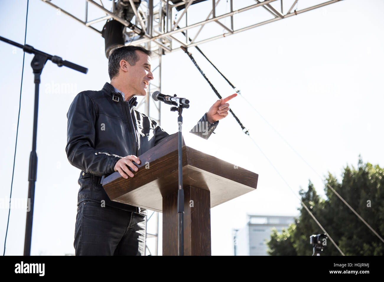 Los Angeles, USA. 21st January, 2017. Los Angeles Mayor Eric Garcetti addresses the crowd in front of Los Angeles City Hall. Thousands of Angelenos gathered in Downtown Los Angeles to march in solidarity with the Women’s March in Washington, DC, protesting Donald Trump’s policies and rhtetoric. Credit: Andie Mills/Alamy Live News Stock Photo