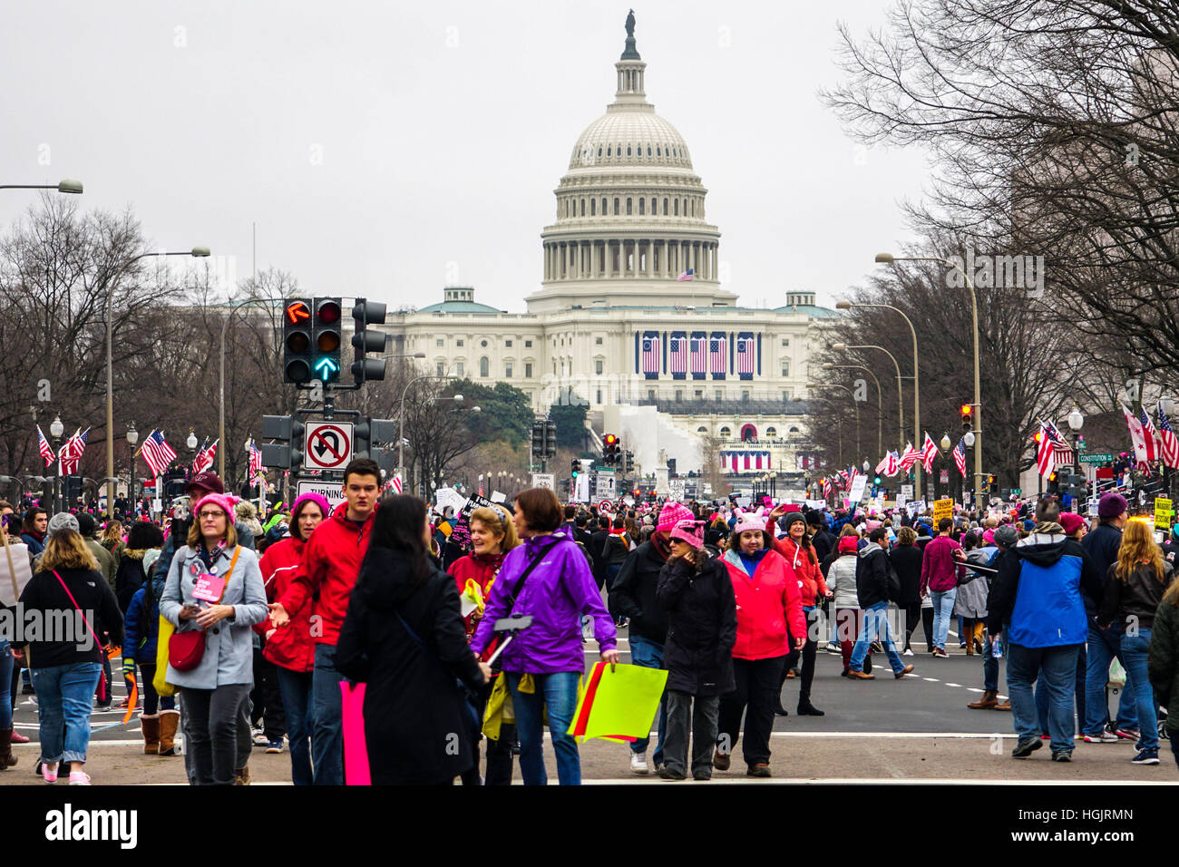 Washington, DC, USA. 21st Jan, 2017. Protesters walk during the Women's March on Washington in Washington, DC.  with the U.S. Capitol in the background. Large crowds attended the anti-Trump rally the day after the U.S.  President Donald Trump was sworn in Stock Photo