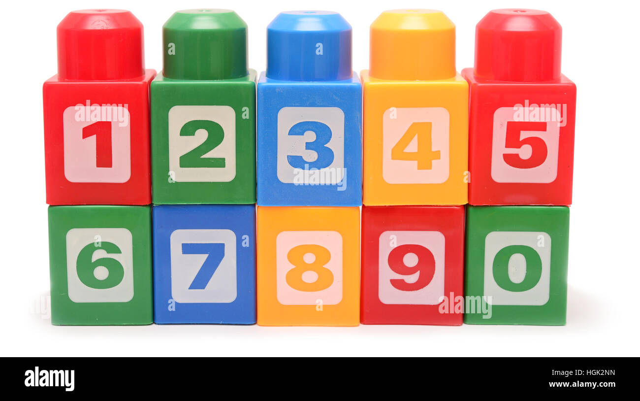Colorful stacked toy plastic building blocks isolated on white ...