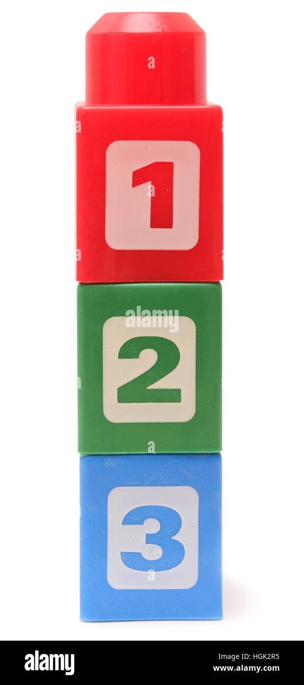 Colorful stacked toy plastic building blocks isolated on white ...