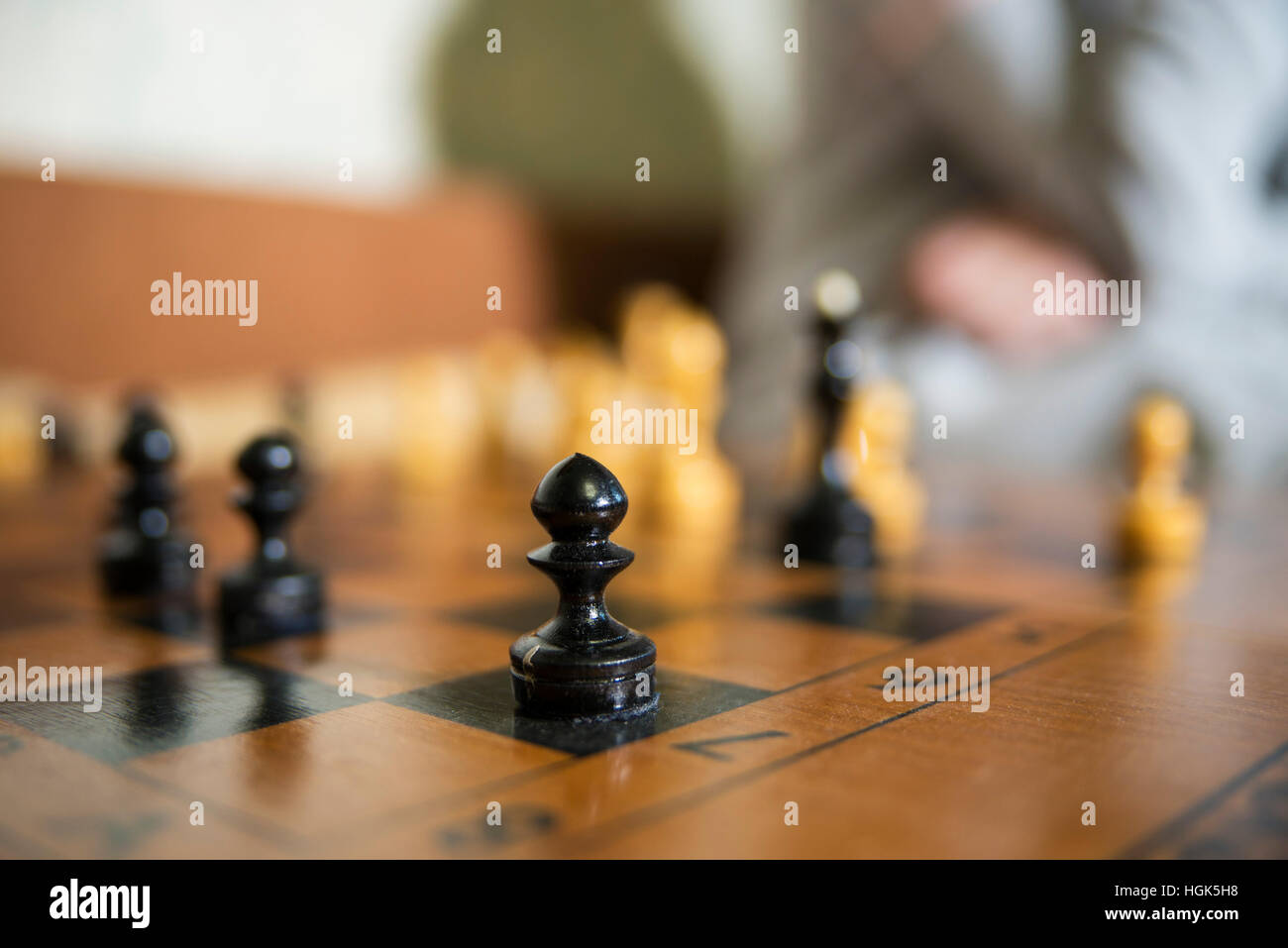 authentic old wood chess Board close focused on black pawn Stock Photo