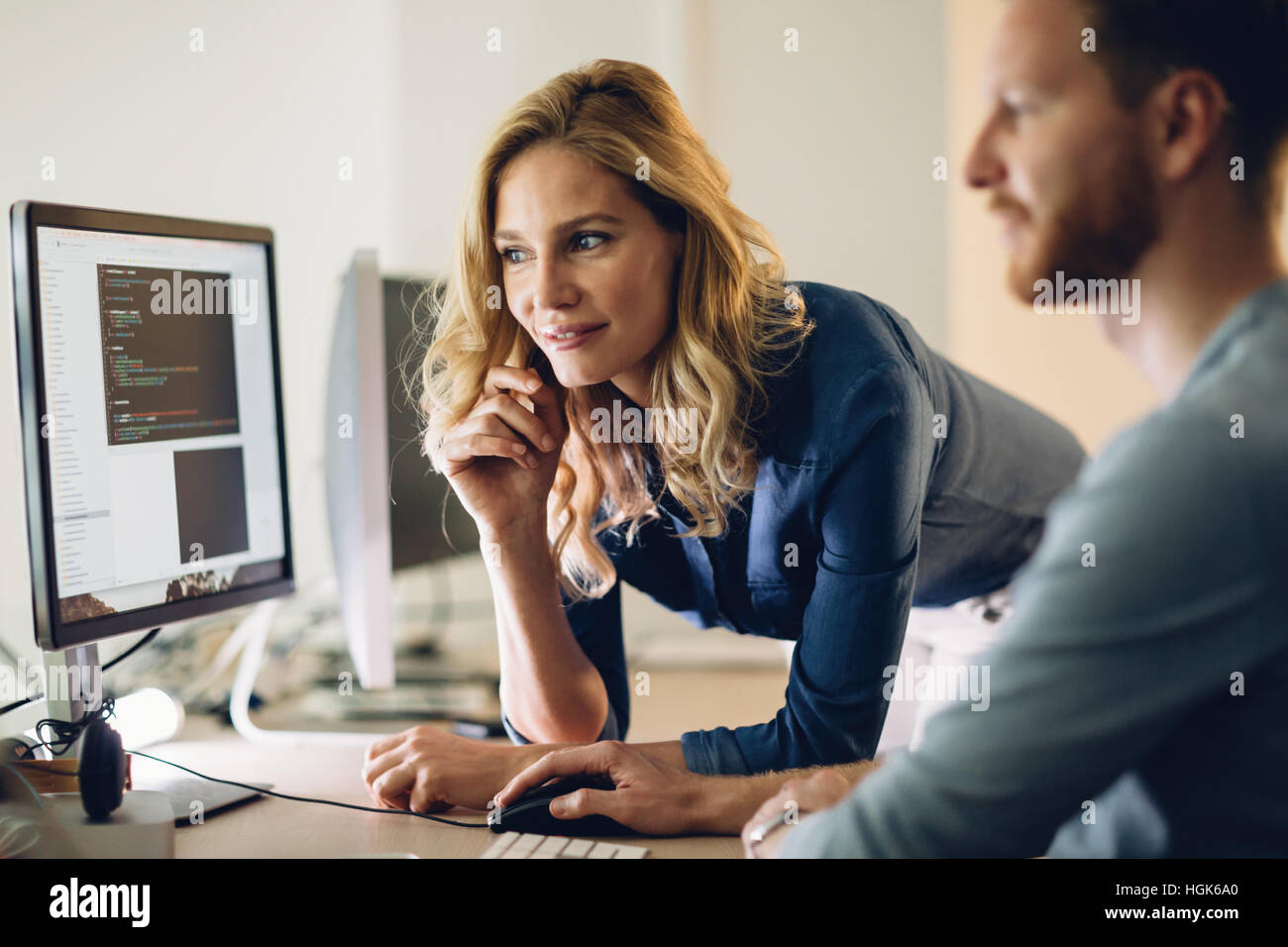 Programmer working in a software developing company office Stock Photo