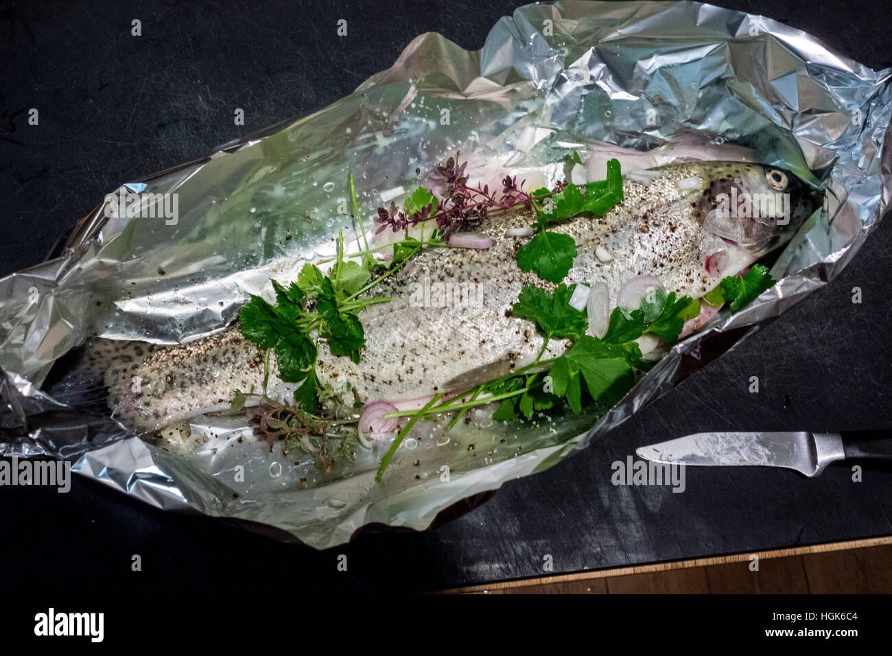 Trout in Tinfoil Ready Prepared For Cooking Stock Photo Alamy