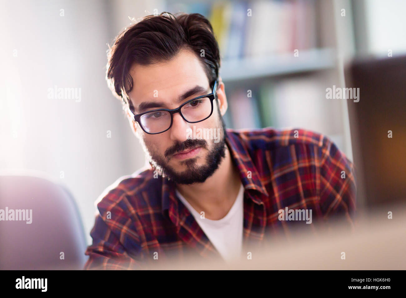 Programmer working in a software developing company office Stock Photo