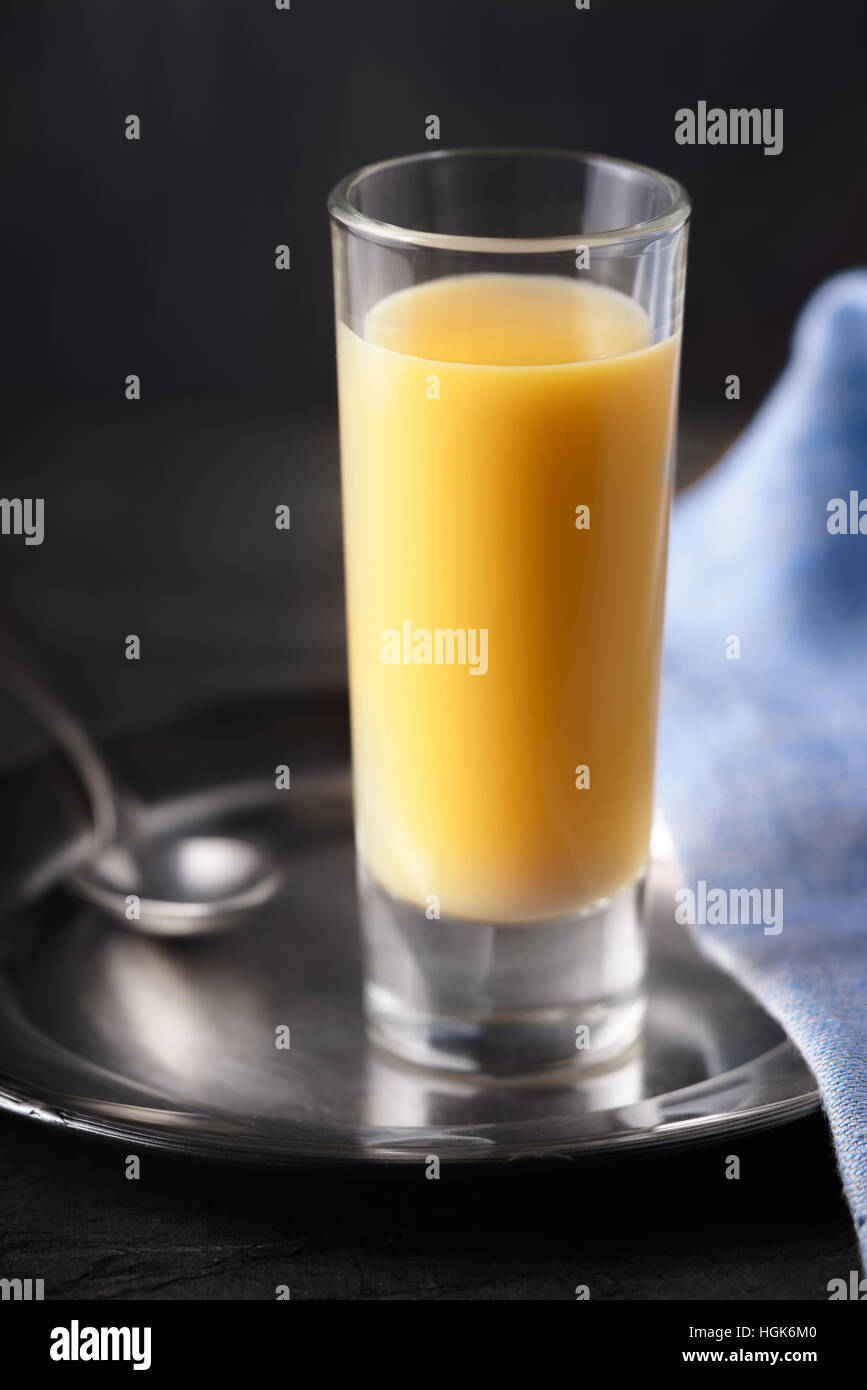 Egg liqueur on the dark background vertical Stock Photo