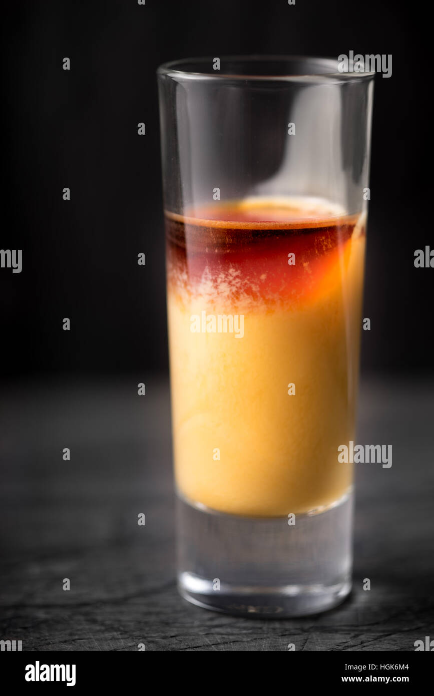Cocktail of egg and cherry liqueur on the dark background Stock Photo