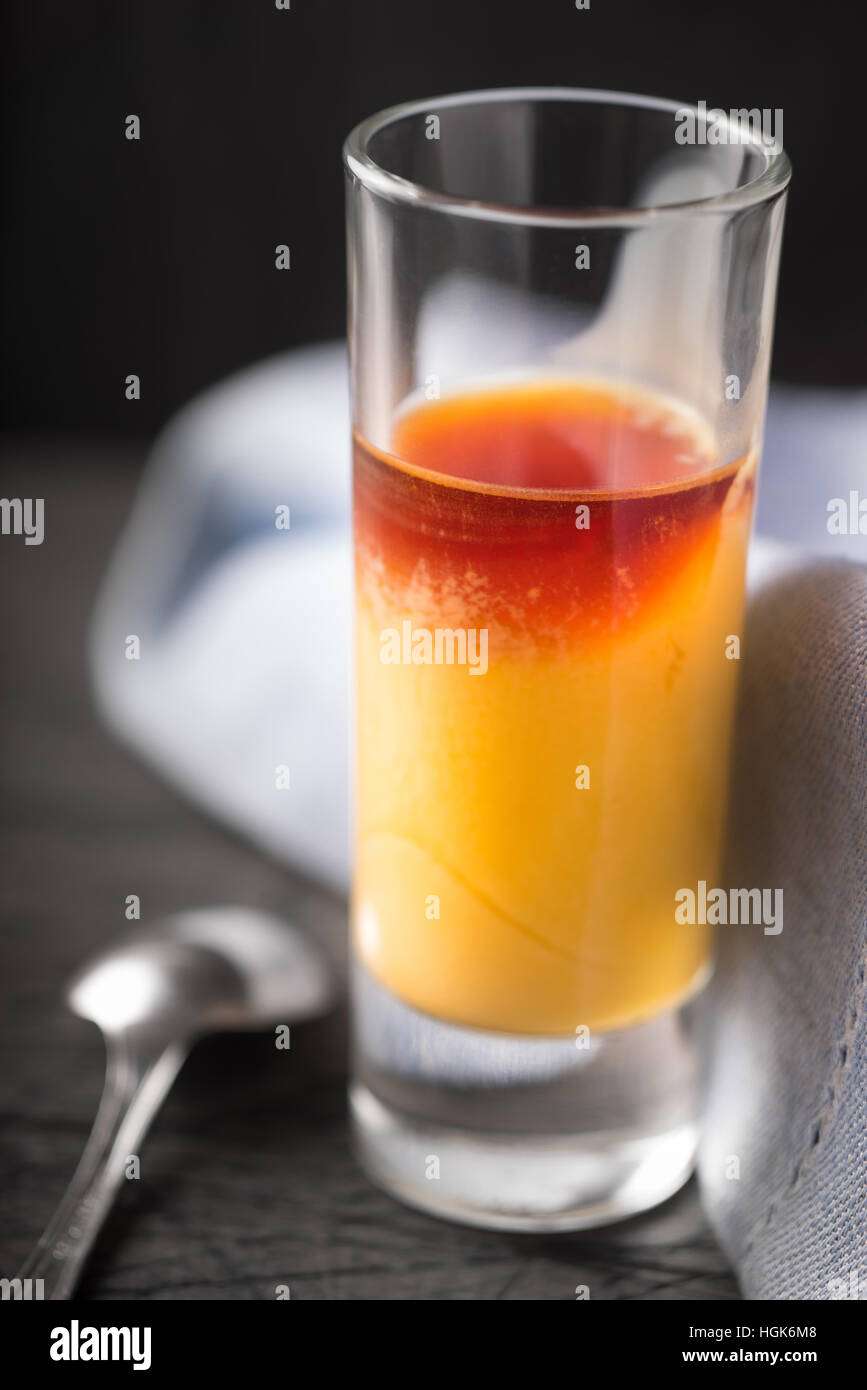 Cocktail of egg and cherry liqueur on the dark background vertical Stock Photo