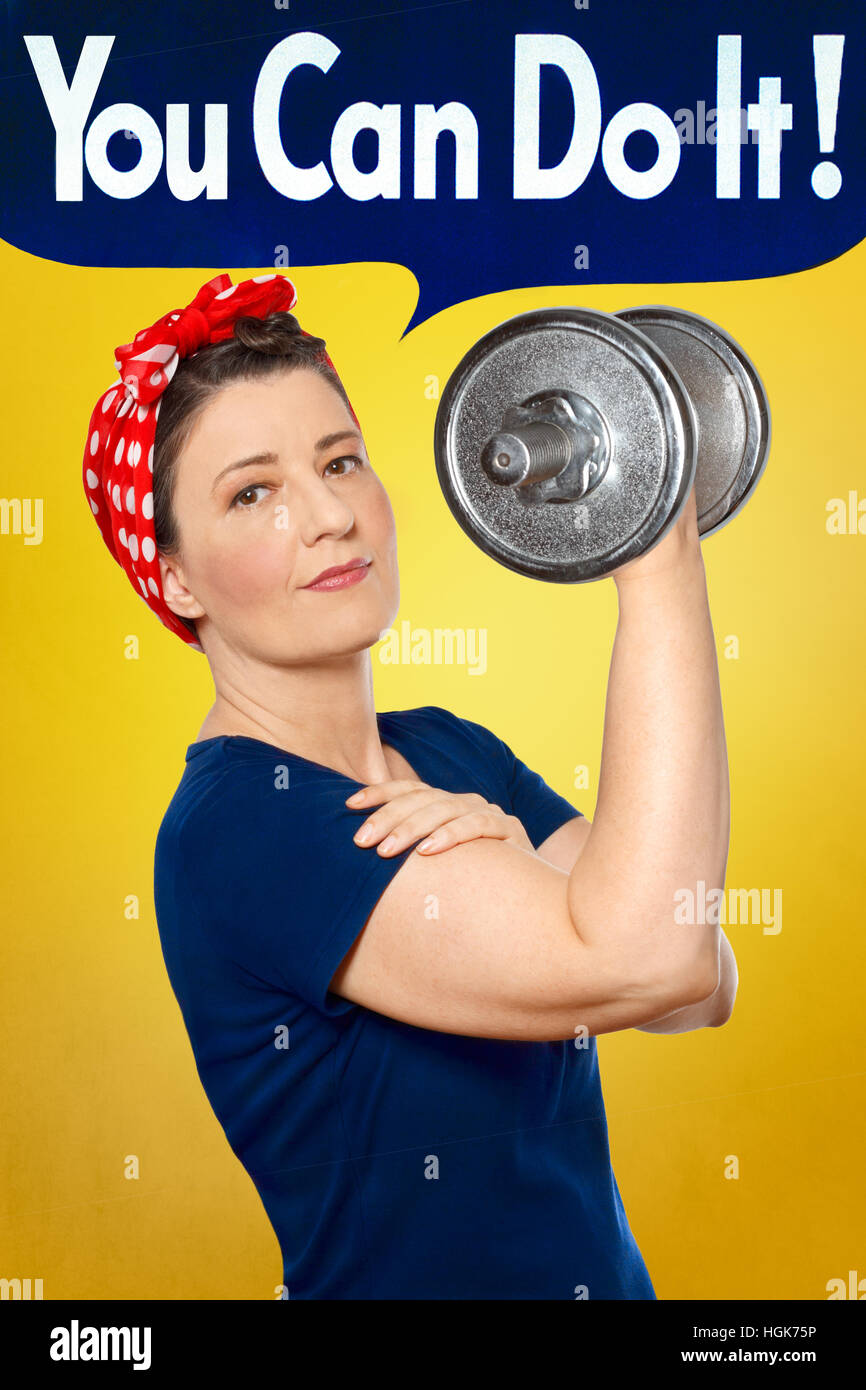 Beefy Rosie Riveter with red kerchief and blue t-shirt lifting a heavy weight, yellow background, YOU CAN DO IT speech bubble Stock Photo
