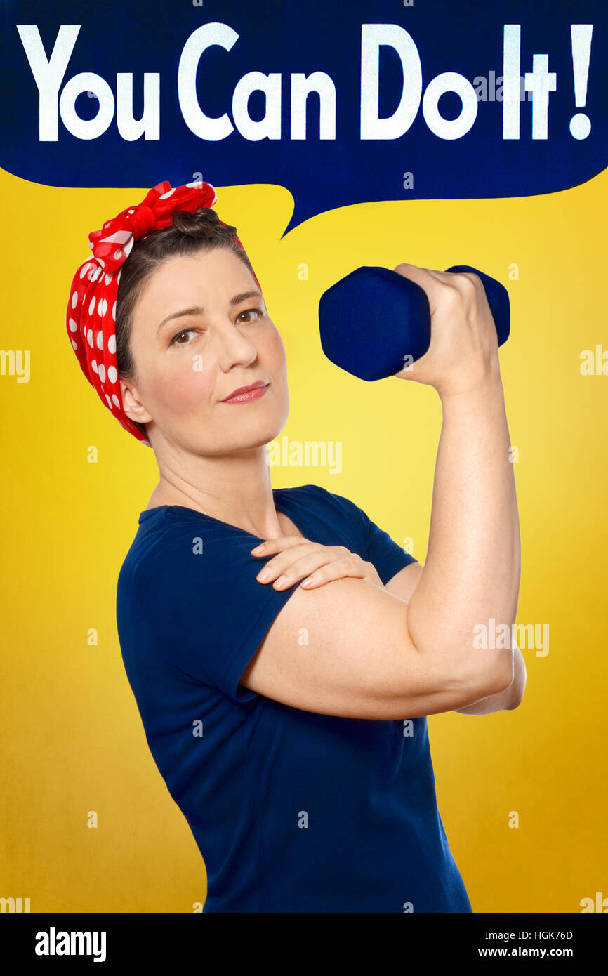 Rosie the Riveter with red kerchief and blue t-shirt lifting a weight in front of yellow background, YOU CAN DO IT speech bubble Stock Photo