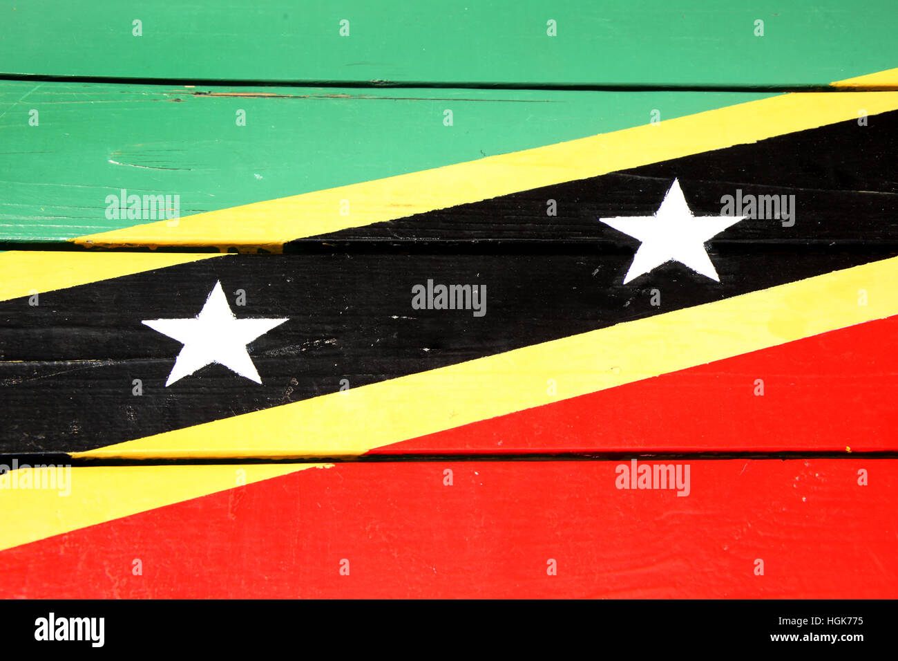 Flag of St Kitts & Nevis painted on wooden planks, in bright colors of red, yellow, green & black. Bassterre, Caribbean. Stock Photo