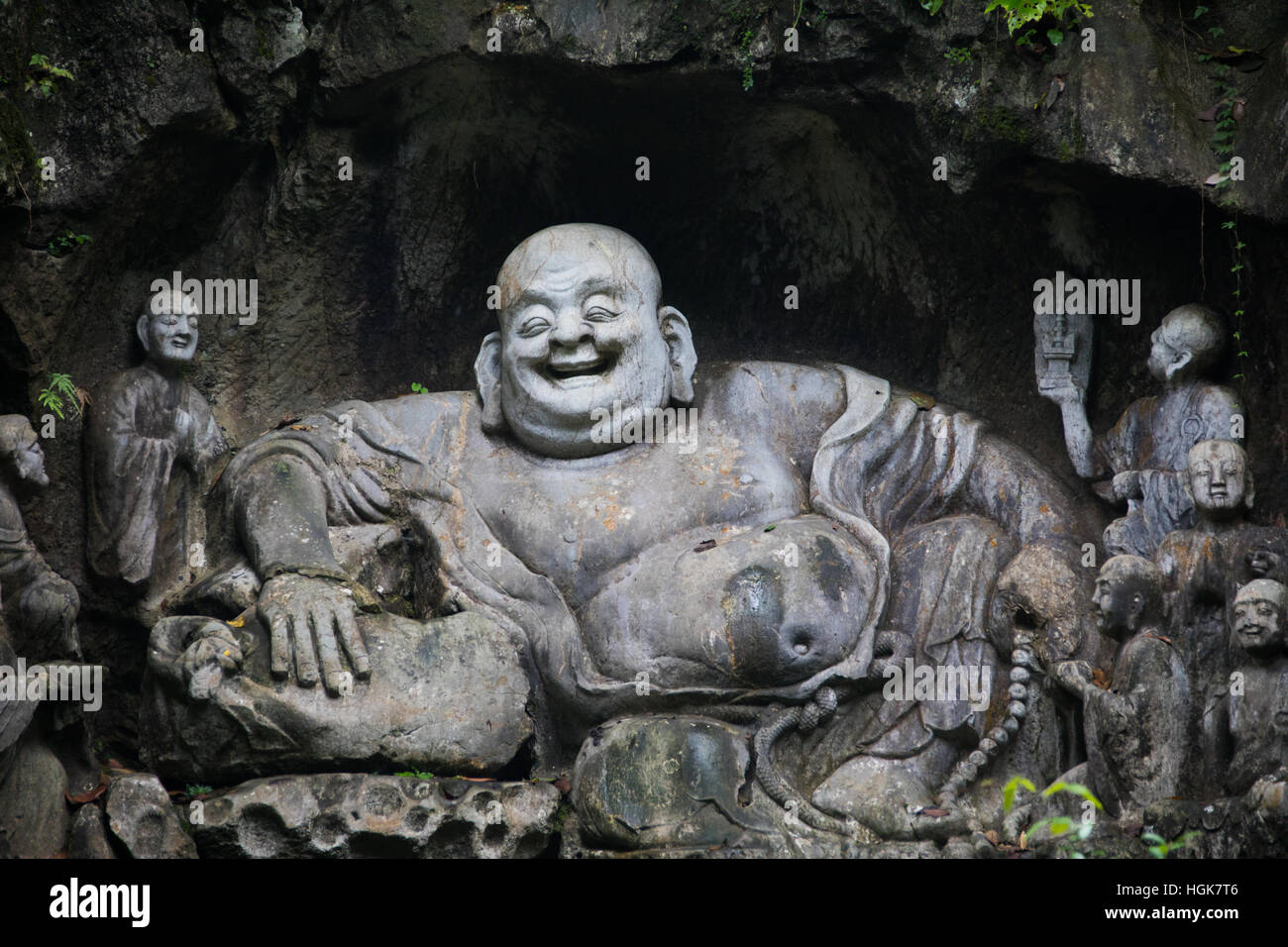Laughing Buddha, Feilai Feng limestone grottoes at Ling Yin temple Hangzhou China Stock Photo