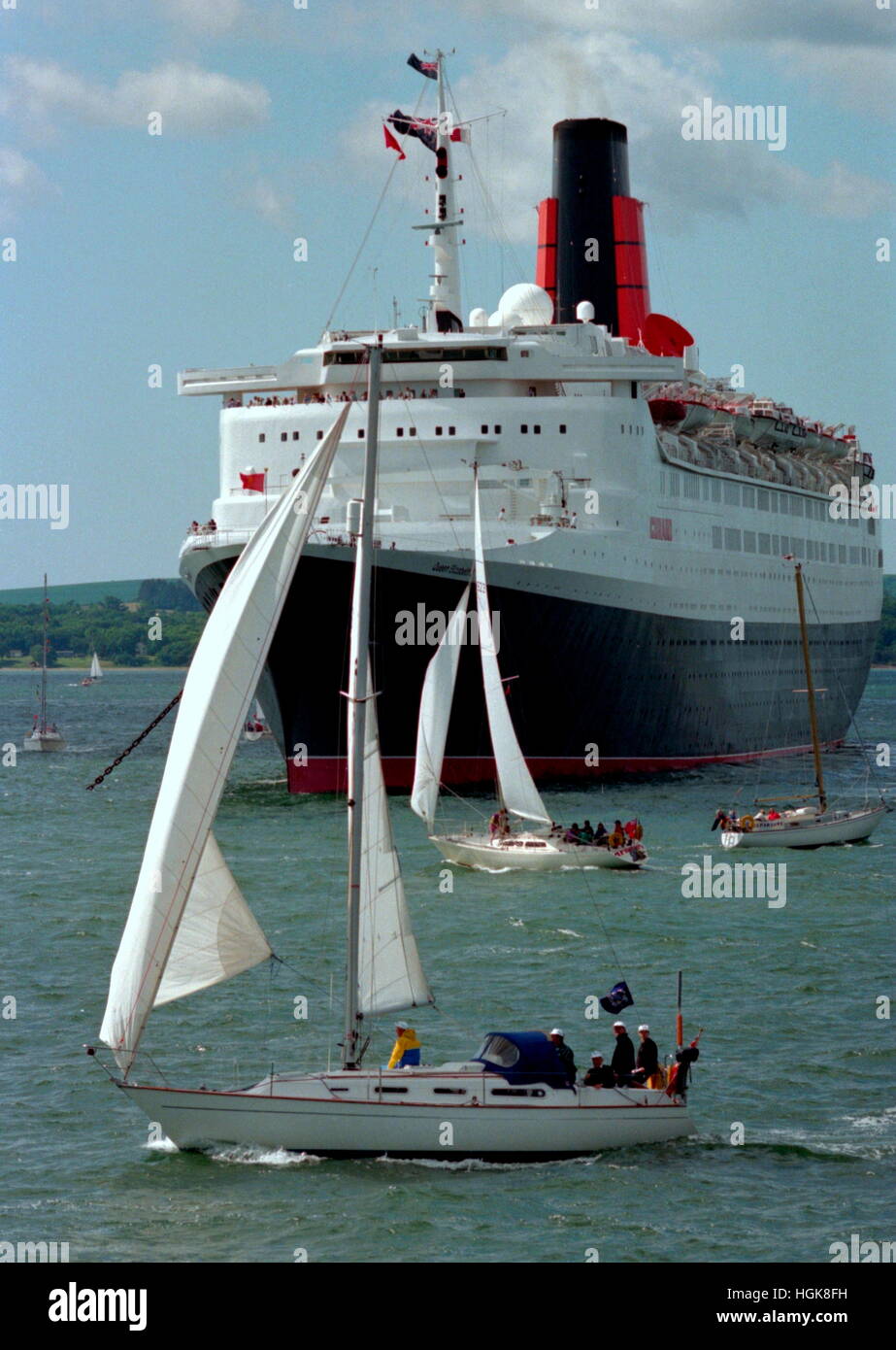AJAXNETPHOTO. 5TH JUNE, 1994. SPITHEAD, ENGLAND. - 50TH D-DAY ANNIVERSARY FLEET - THE CUNARD LINER QUEEN ELIZABETH 2, ONE OF SEVERAL MERCHANT VESSELS ON REVIEW. PHOTO;JONATHAN EASTLAND/AJAX REF:940506 8 Stock Photo