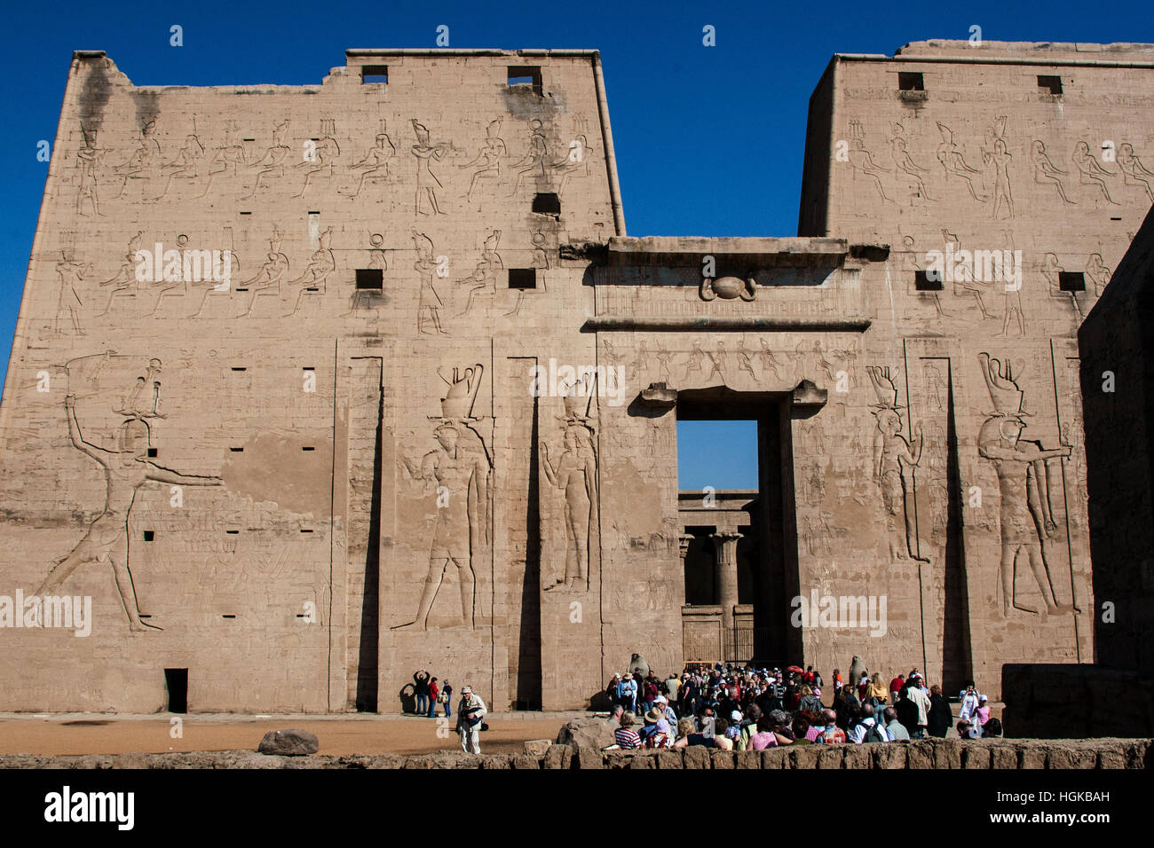 Group of tourists at Temple of Edfu, dedicated to the god Horus, on the Nile River in upper Egypt  One of the best preserved. Stock Photo