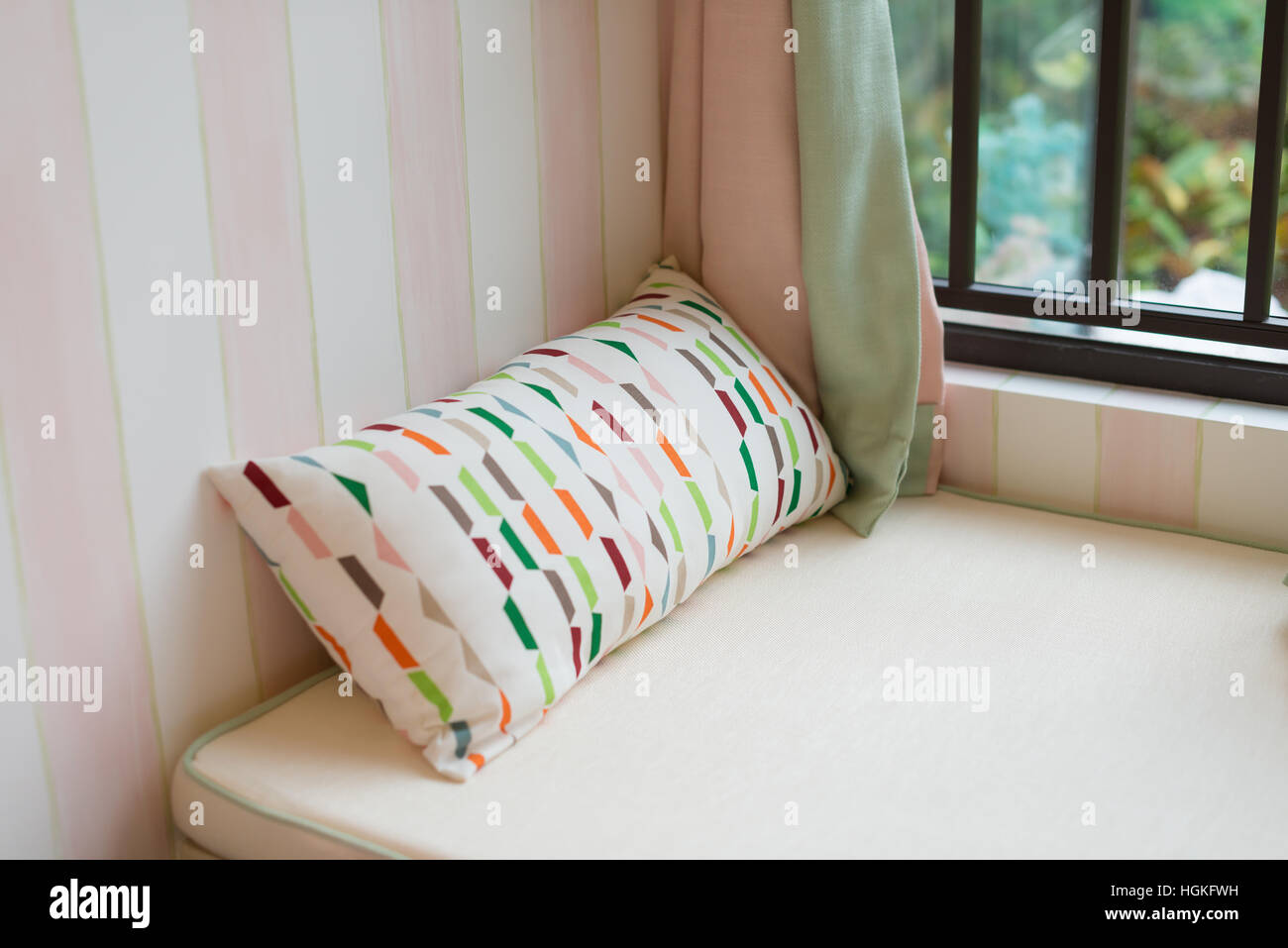 resting area of a cozy window seat with cushion in the morning horizontal composition Stock Photo