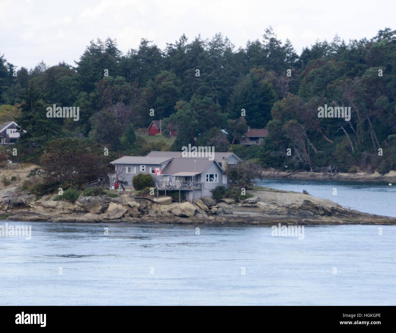 A home in the Gulf Islands near the water as viewed from the ferry to