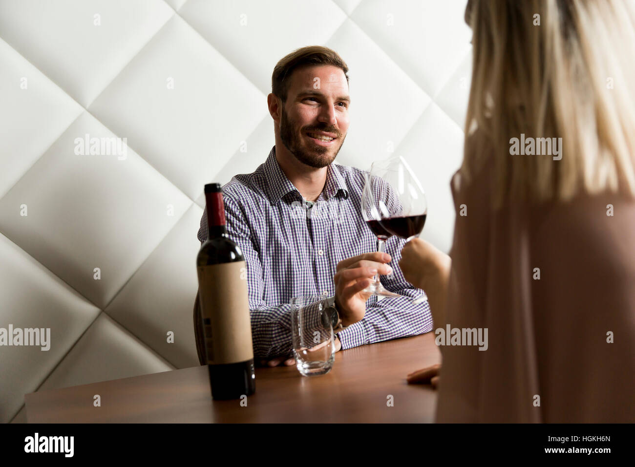 Lovely young couple sitting in the wine bar Stock Photo