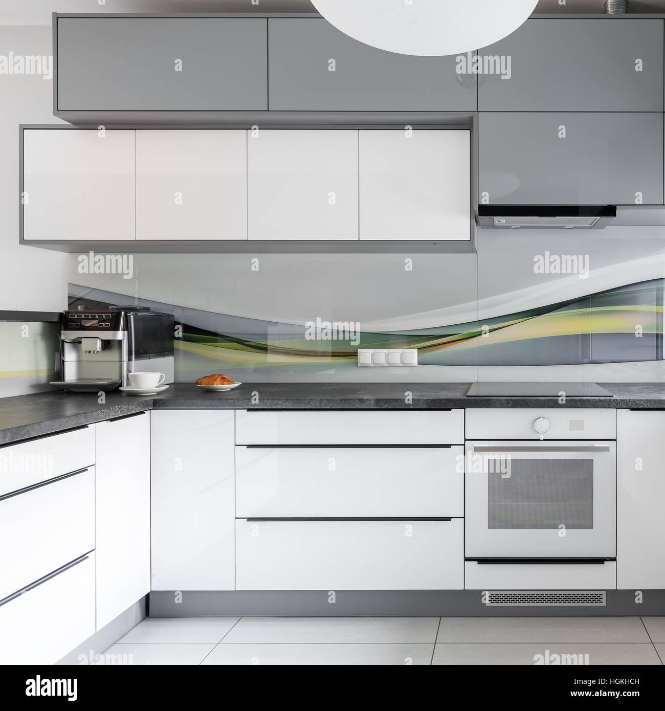 Light modern kitchen interior with white and grey furniture Stock Photo ...