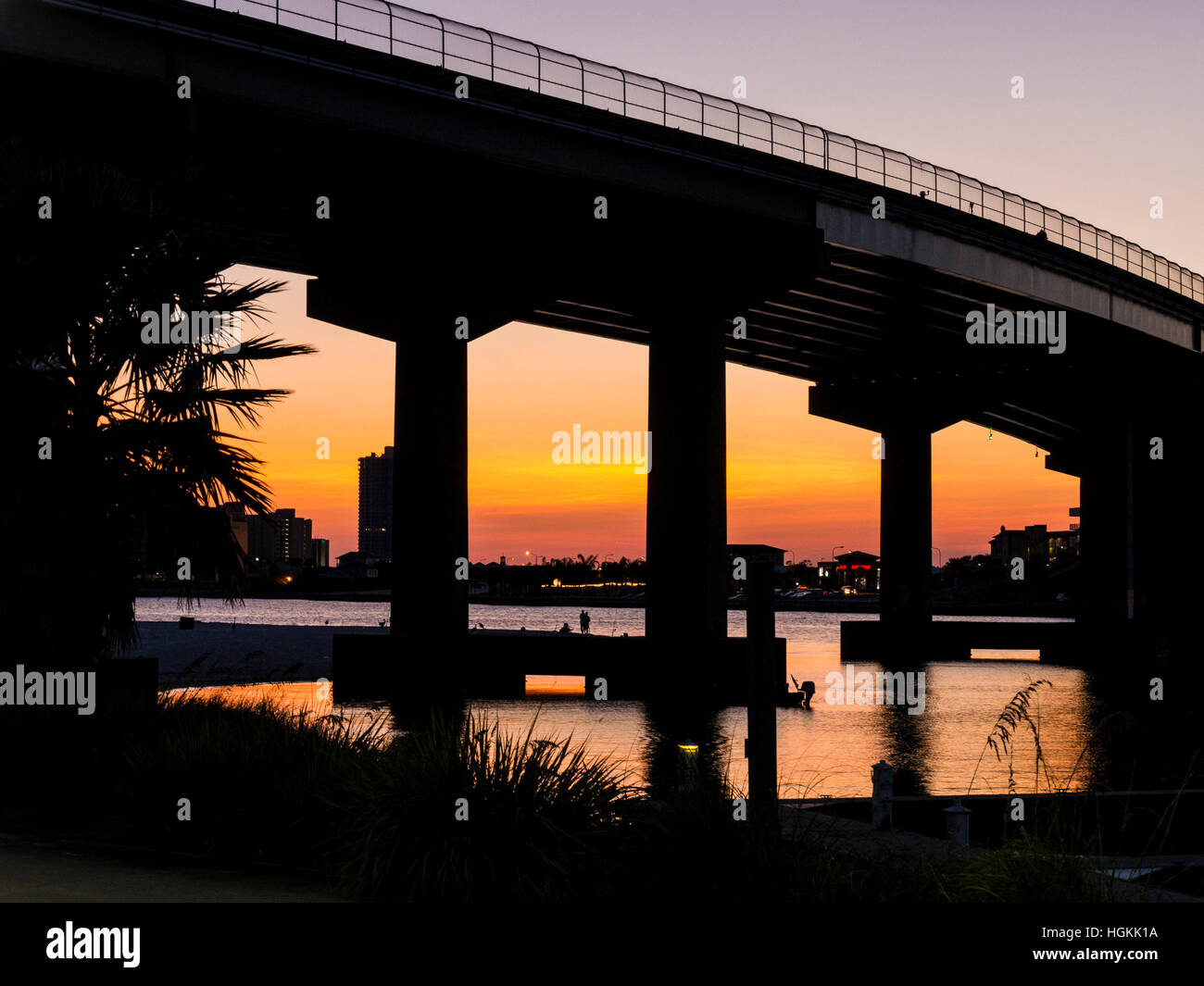 Sunset under the bridge from Cobalt's Restaurant, Orange Beach, Alabama. Stock Photo