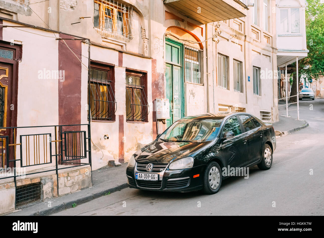 Tbilisi, May 20, 2016 The View Of Parked Black Glinting Volkswagen Jetta Car Along