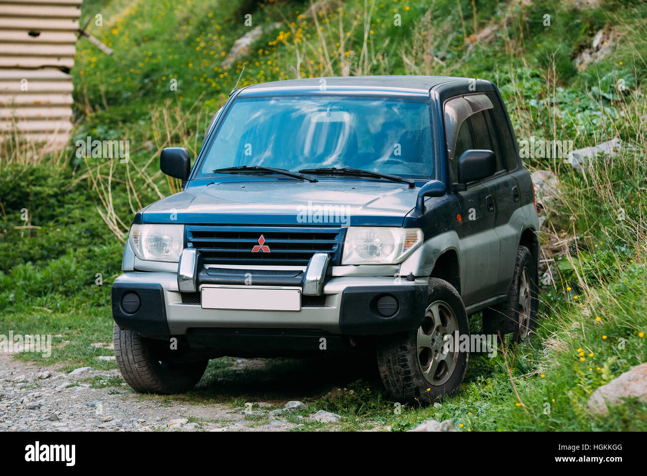 Darial Gorge, Georgia - May 21, 2016: Old Mitsubishi Montero Pajero SUV parking on road. Mitsubishi Pajero Sport is a mid-size SUV produced by the Jap Stock Photo