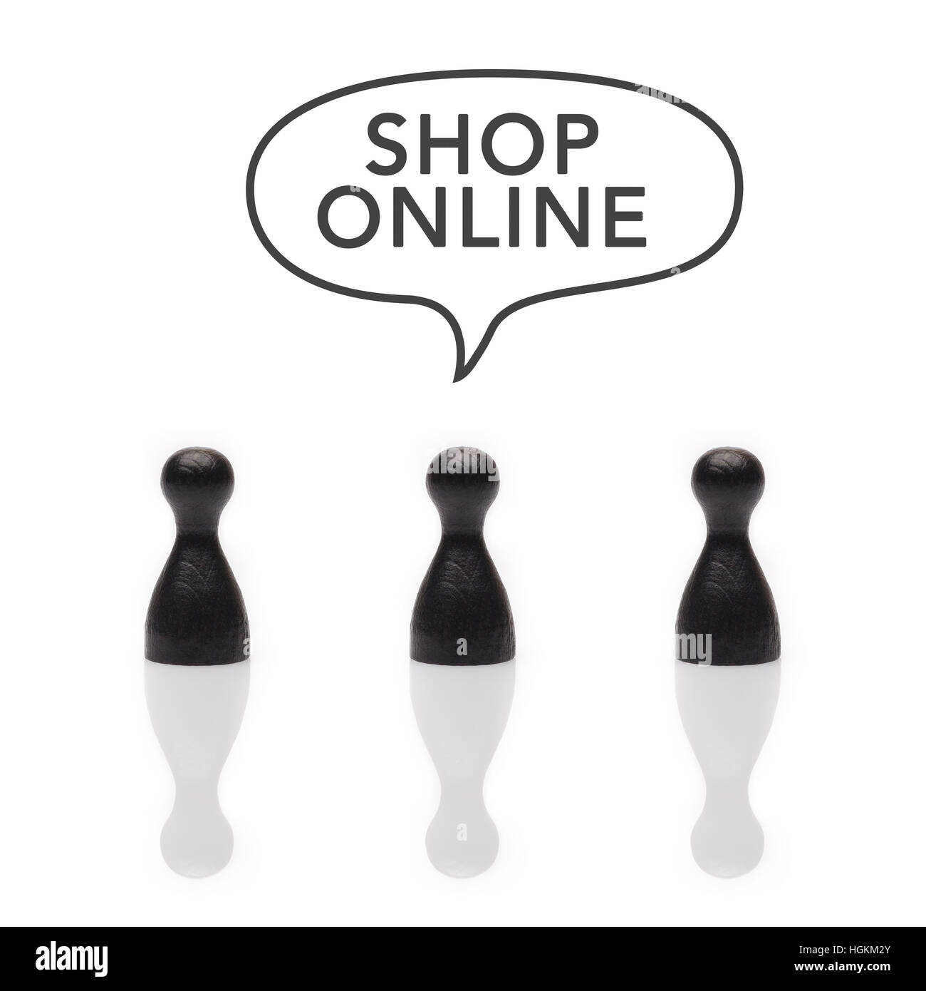 Black pawns say 'shop online' with text balloon in black and white Stock Photo
