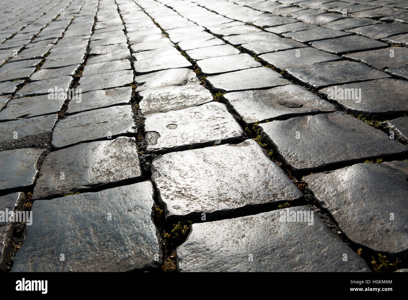 Angled pattern of old cobbled street in Italy Europe Stock Photo