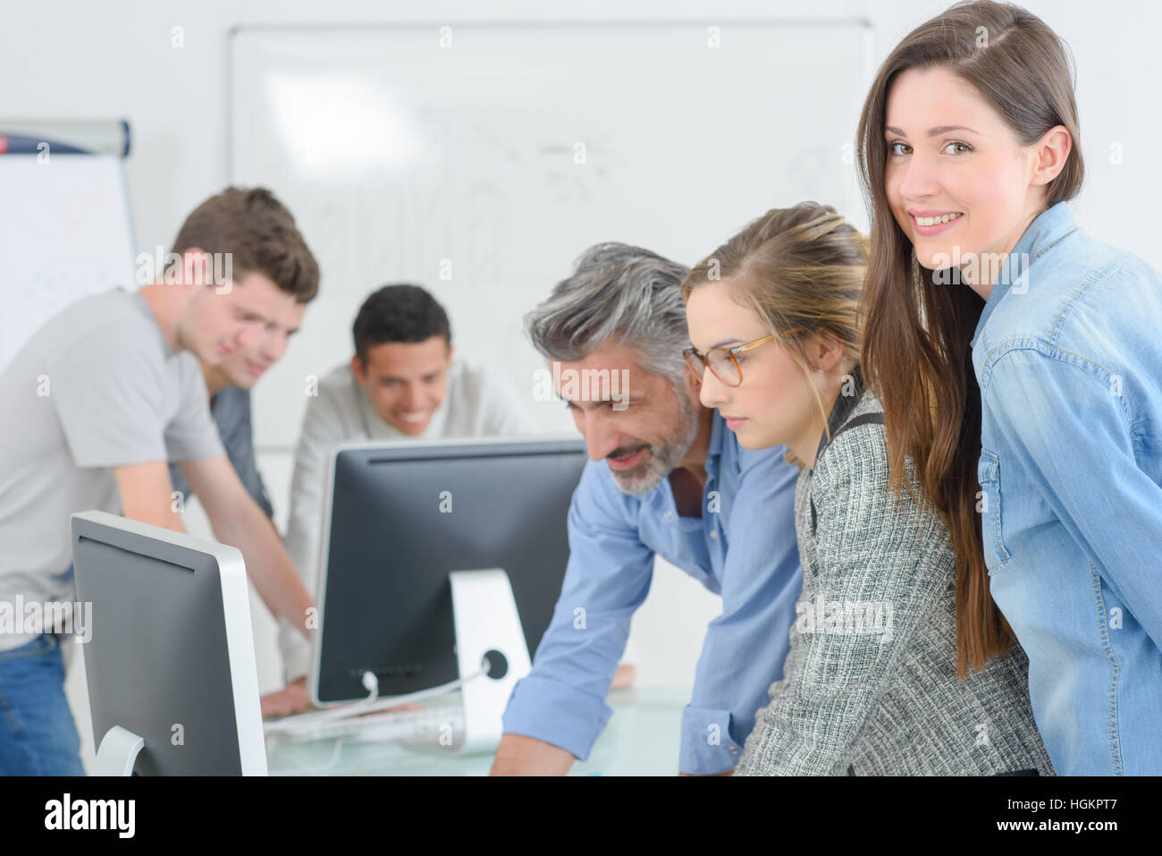 Classroom of students, girl smiling to camera Stock Photo - Alamy
