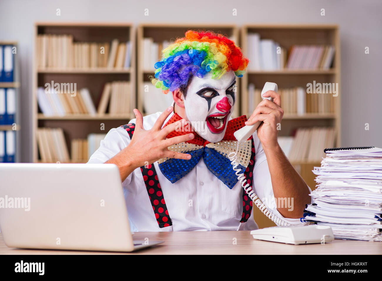 Work Cloan Clown businessman working in the office Stock Photo - Alamy