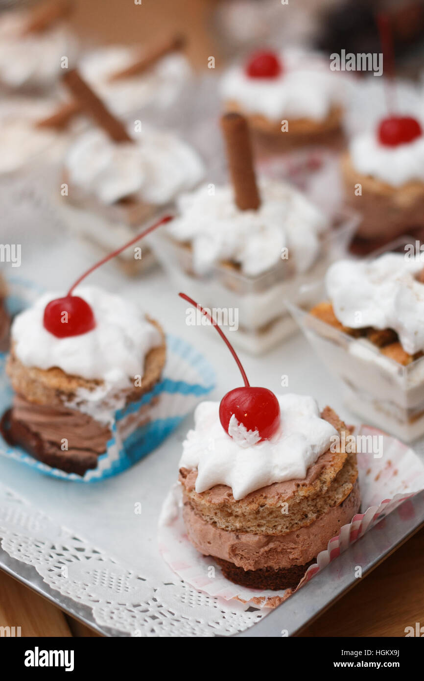 Dessert with chocolate mousse and whipped cream with cherry on top shot in  artificial light Stock Photo - Alamy