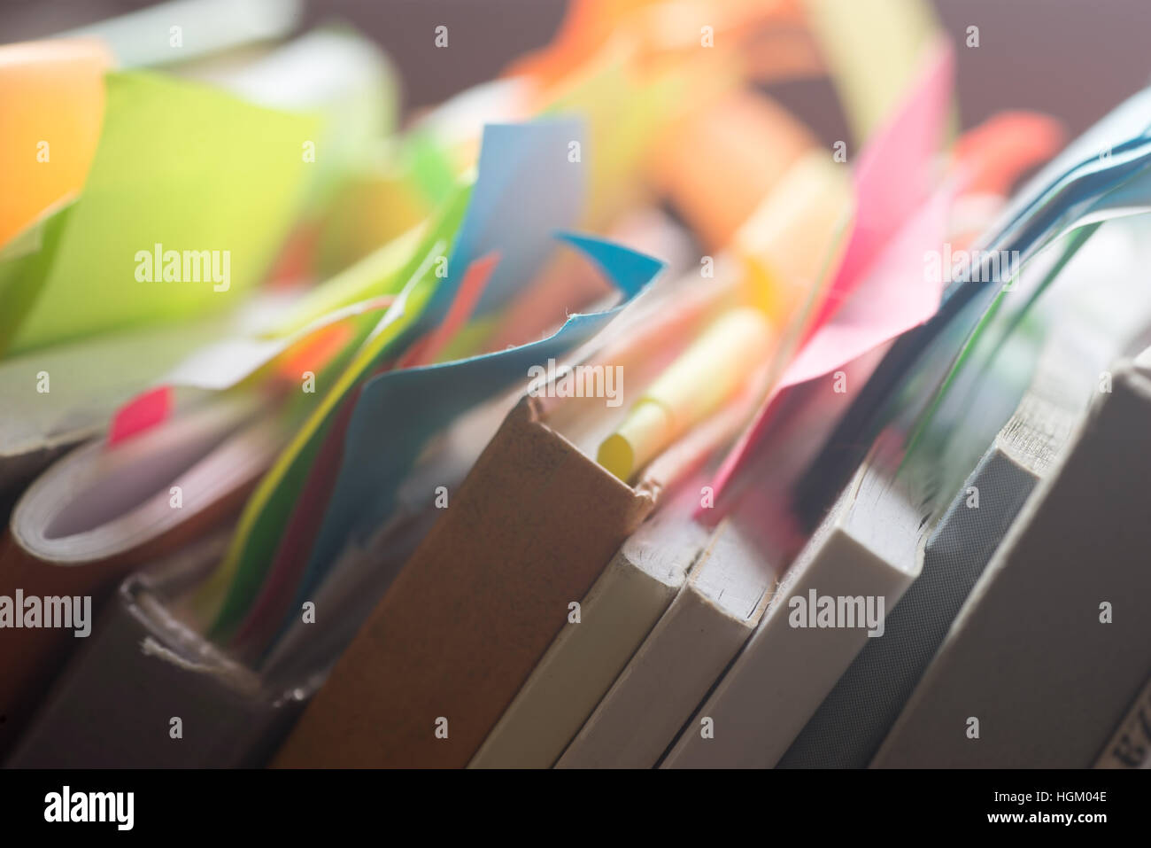 group of books and notebooks with multicolored stickers Stock Photo