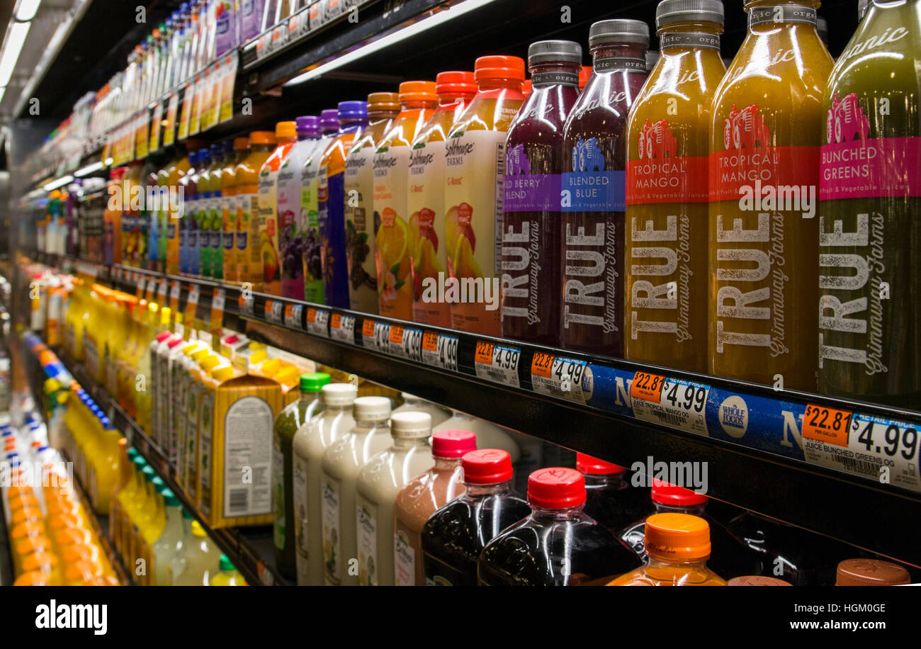bottles of juice in a market Stock Photo Alamy
