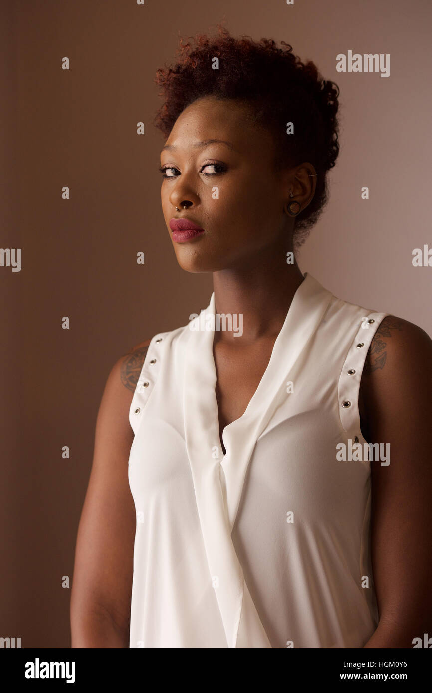 Woman in a white top hi-res stock photography and images - Alamy