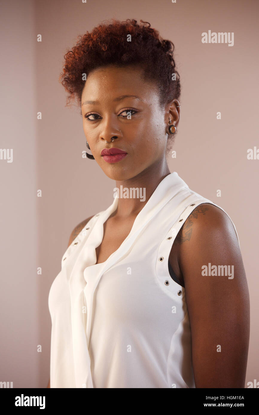 Woman in black top indoors hi-res stock photography and images - Alamy