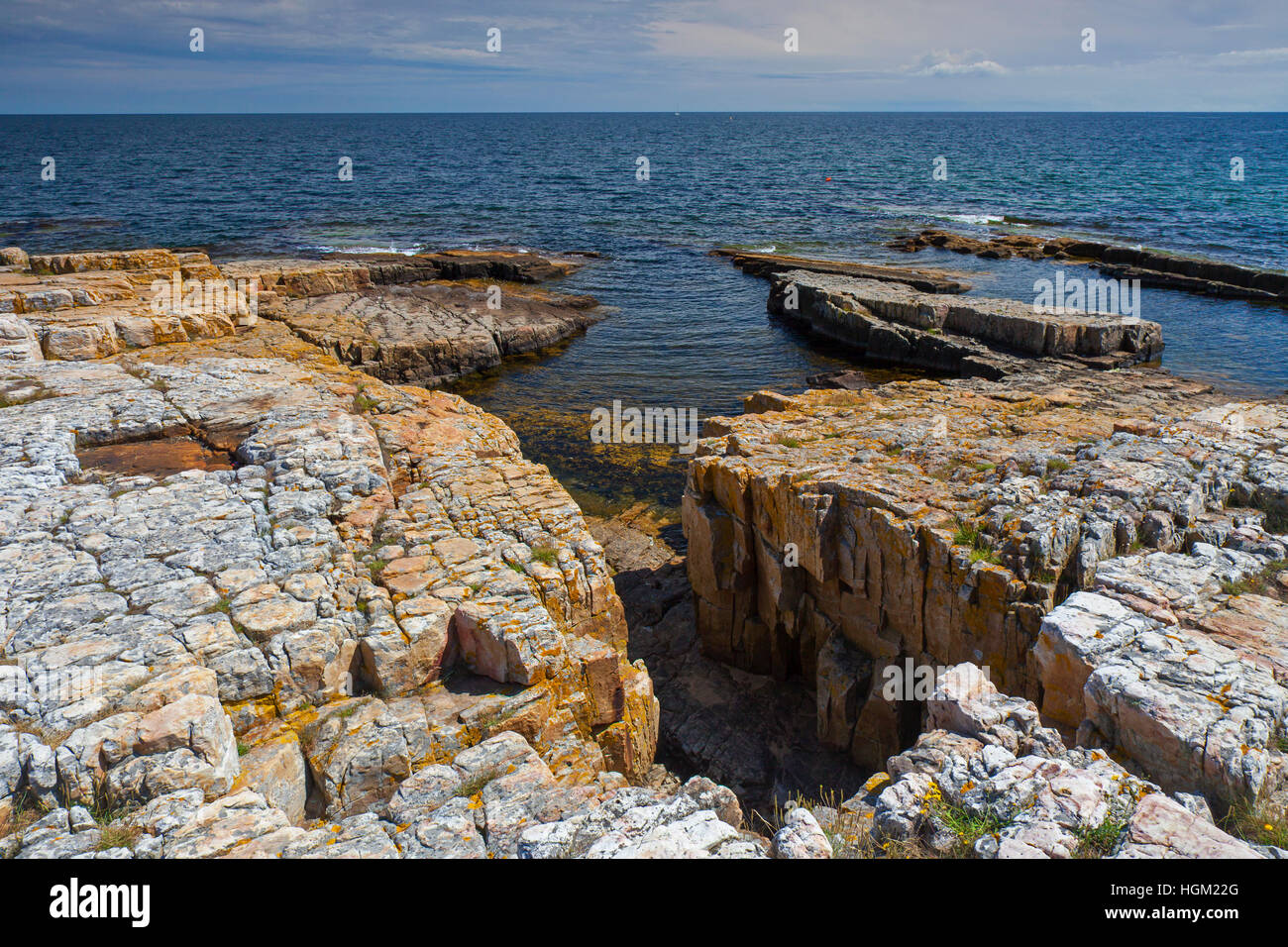 Rocky coast along the Baltic Sea at Varhallarna, Österlen, Skane / Scania, Sweden Stock Photo