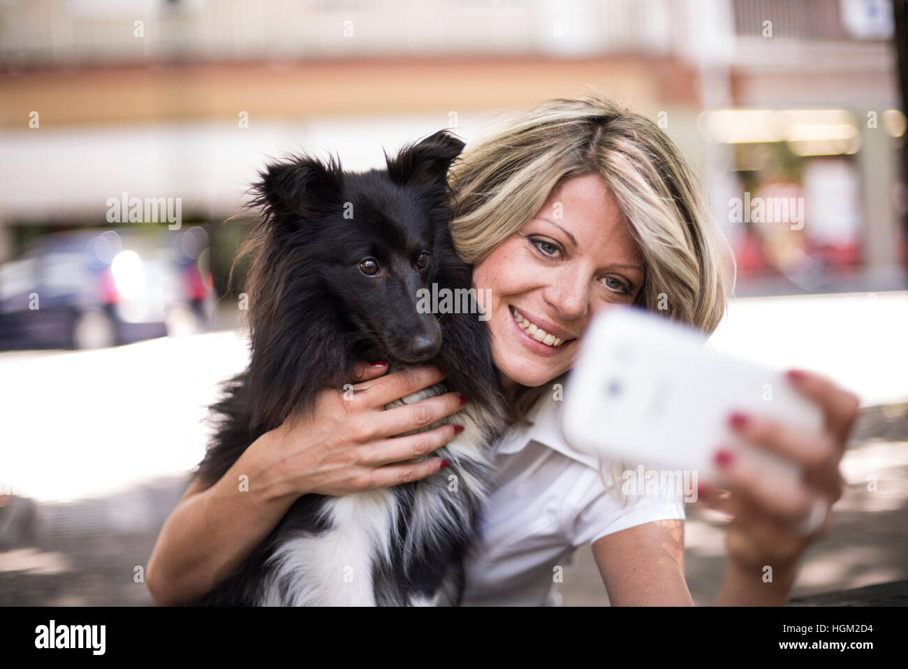 Young woman making a selfie with her dog Stock Photo - Alamy