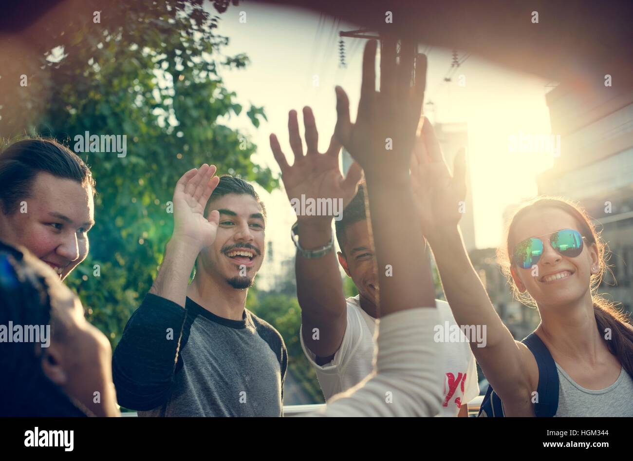 Diverse Group People High Five Concept Stock Photo - Alamy