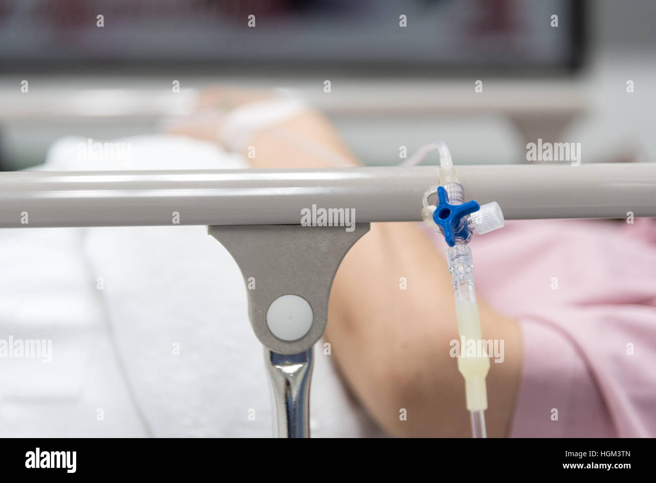 Close-up IV needle on patient  in the hospital Stock Photo