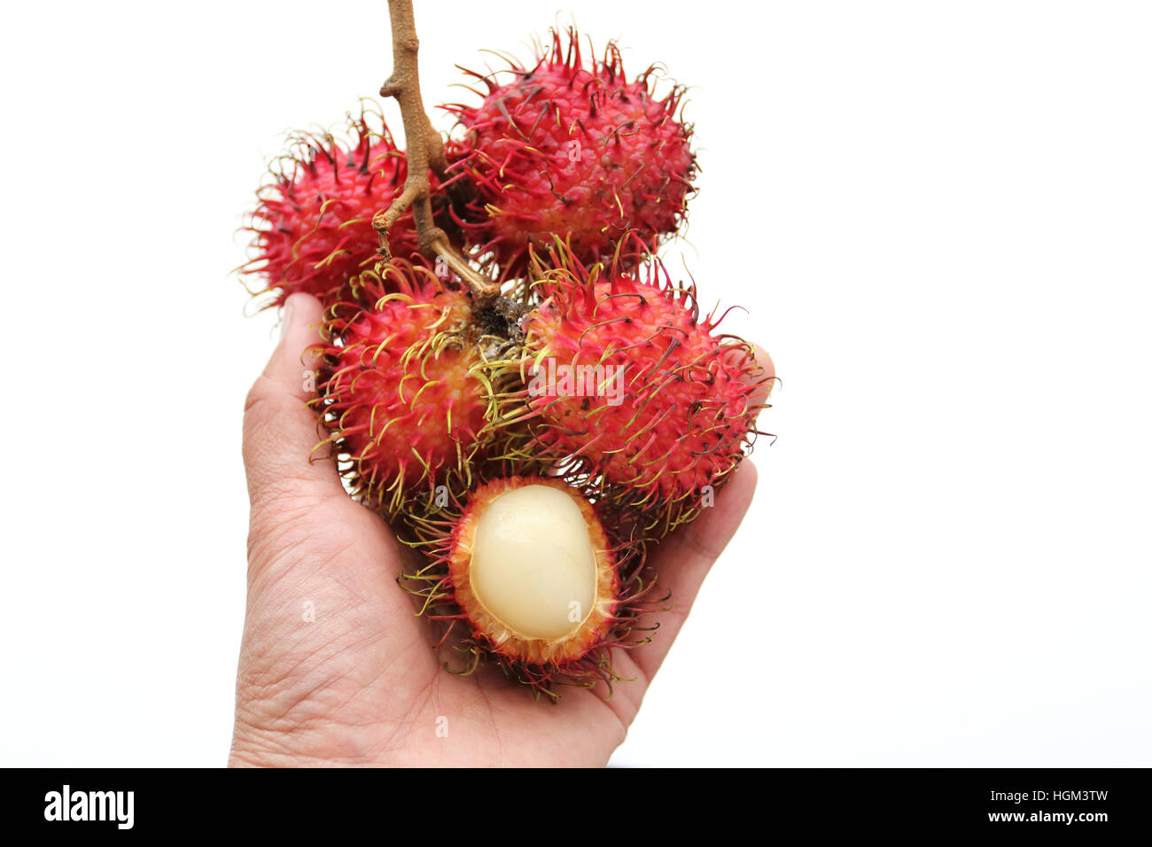 Close up of Nephelium lappaceum or also known as Rambutan fruits isolated against white background Stock Photo