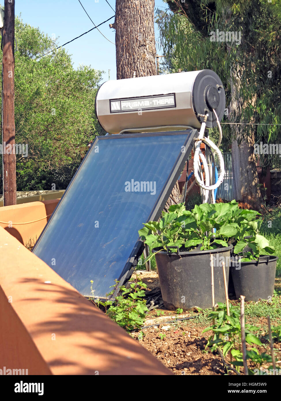 Solar water heater in garden. Lassi Kefalonia Greece. Stock Photo