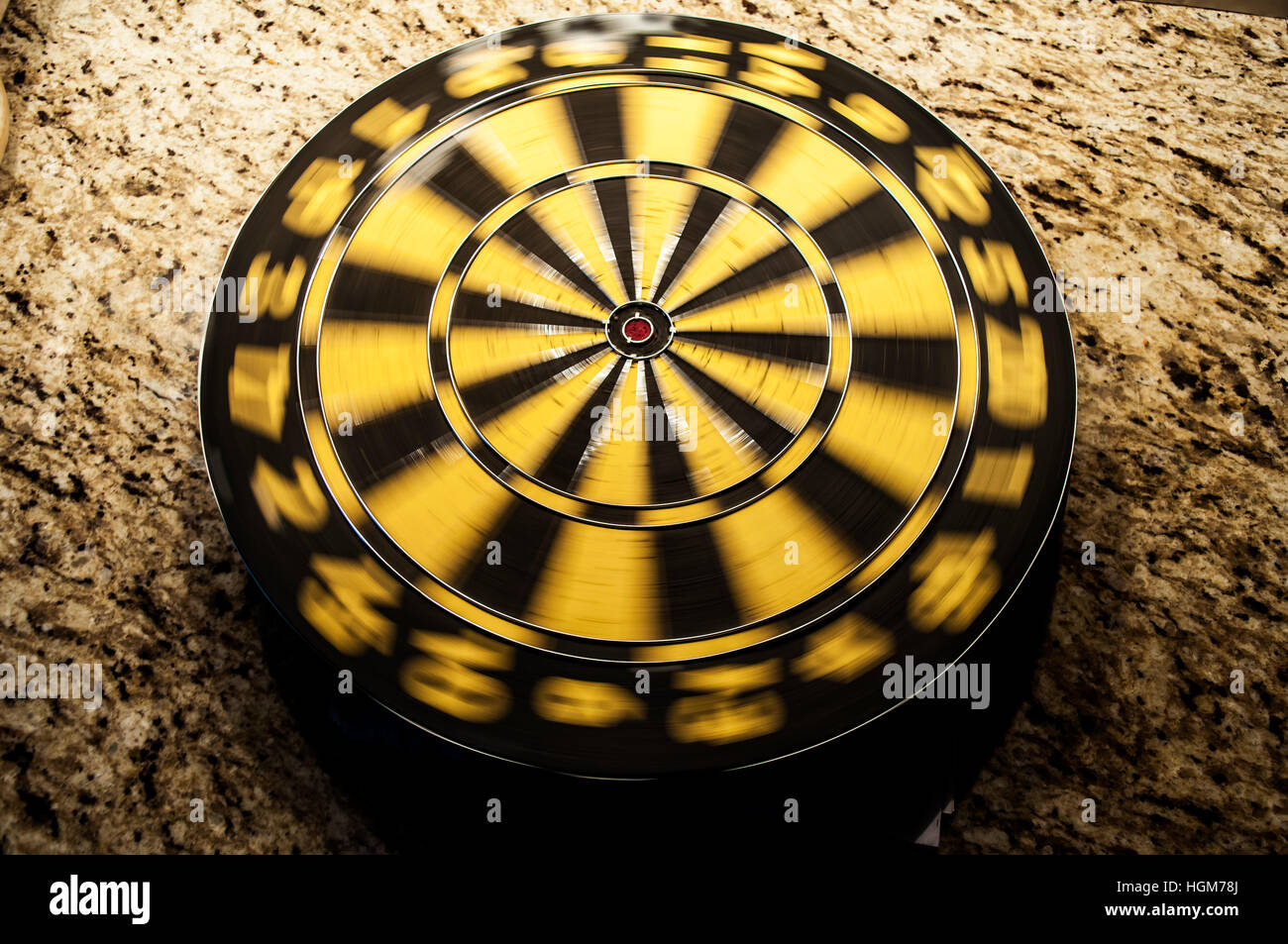 A gently spinning dart board. An icon for movement, slow motion, not