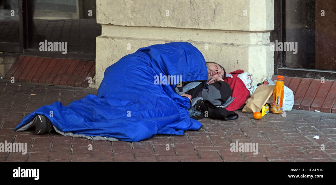 Homeless Rough Sleeper, office area, Liverpool, Merseyside, North West England, UK Stock Photo