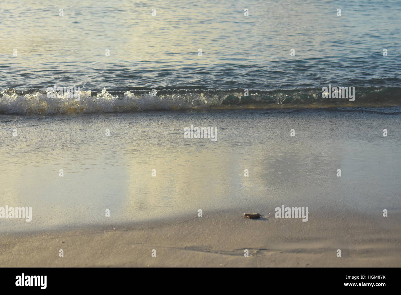 waves lapping beach Stock Photo