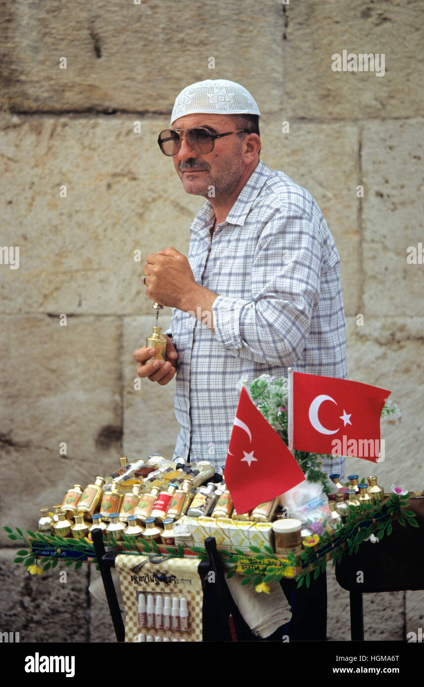Portrait or a Turkish Man or Street Vendor Wearing a Muslim Skullcap, or Taqiyah, and Selling Perfume from Stand on Streets of Konya Turkey Stock Photo
